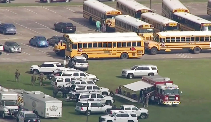 In this image taken from video law enforcement officers respond to a high school near Houston after an active shooter was reported on campus, Friday, May 18, 2018, in Santa Fe, Texas. The Santa Fe school district issued an alert Friday morning saying Santa Fe High School has been placed on lockdown. - (KTRK-TV ABC13 via AP)