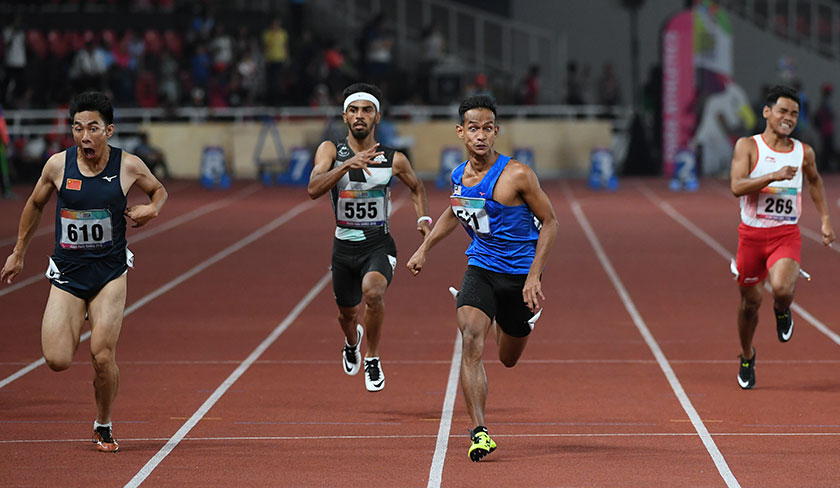 Atlet negara Mohamad Ridzuan Mohamad Puzi berjaya memperoleh pingat emas pada acara akhir 100m balapan kategori lelaki T36 sempena Temasya Sukan Para Asia 2018 di Stadium Gelora Bung Karno. - Foto Bernama