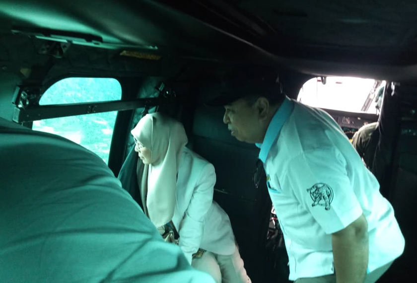 Datuk Seri Dr Wan Azizah given an aerial briefing of the state of Cameron Highlands by Datuk Shahar.