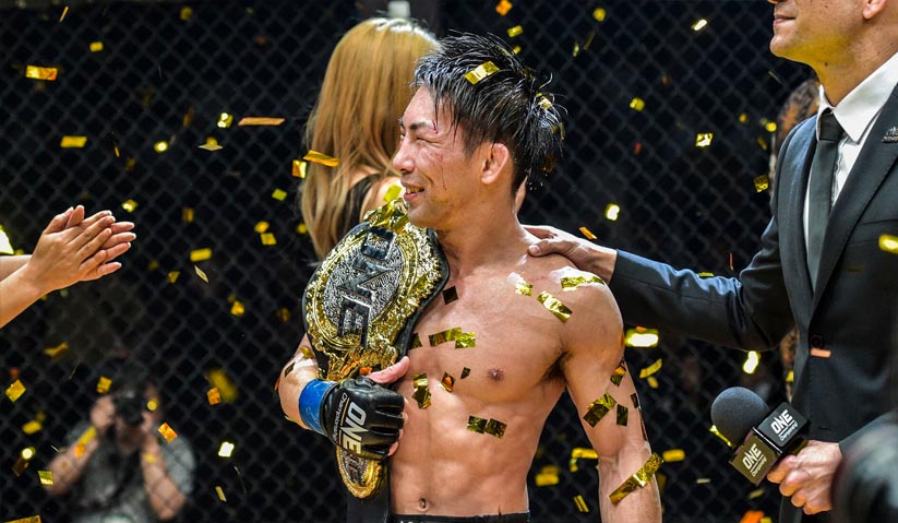 Yosuke Saruta with the ONE Strawweight World Championship belt. - ONE photo