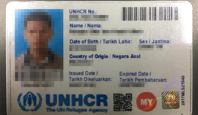 Pemeriksaan ke atas rumah yang didiami suspek menemui 42 keping kad UNHCR atas pelbagai nama dan 25 keping kad yang masih belum dicetak sepenuhnya. - Foto PDRM