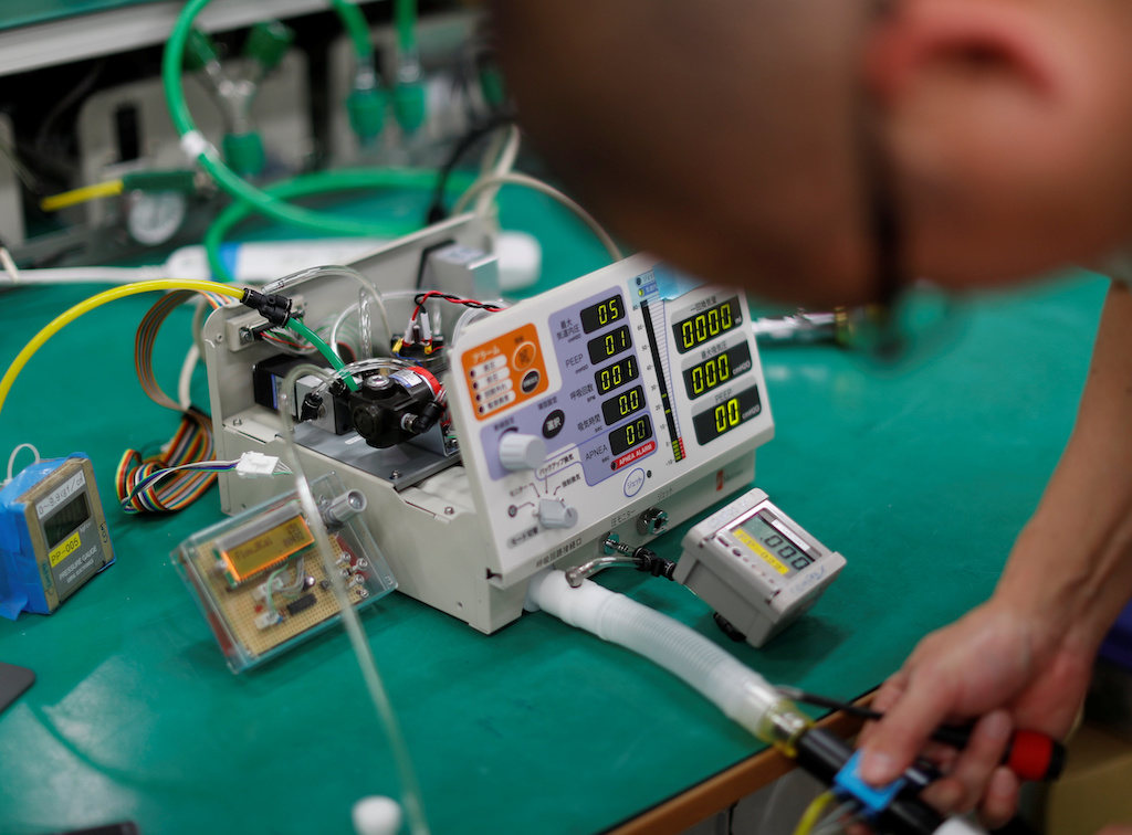 An employee of Metran Co. checks the company's 'Compos X' ventilator, which was originally developed for animals but may be used for human coronavirus disease (COVID-19) patients, at their factory in Kawaguchi, north of Tokyo, Japan April 2, 2020. Picture taken April 2, 2020. REUTERS/Issei Kato