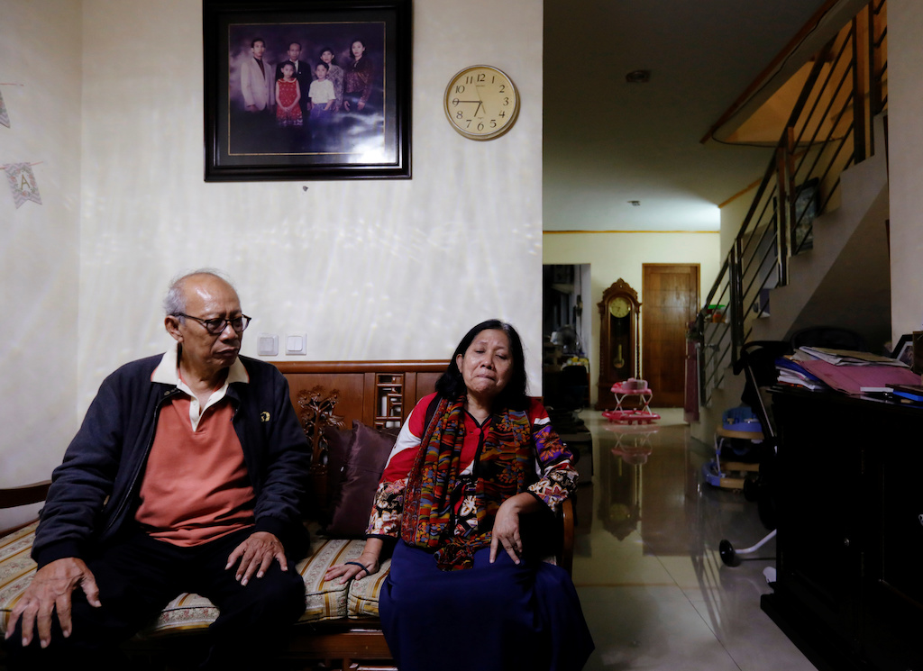 Bambang Purnomo Sidik, 72, and Nina Widyawati, 65, react as they talk about their daughter Ratih Purwarini, a doctor who passed away due to the coronavirus disease (COVID-19), at their house in Jakarta, Indonesia April 8, 2020. Picture taken April 8, 2020. REUTERS/Willy Kurniawan