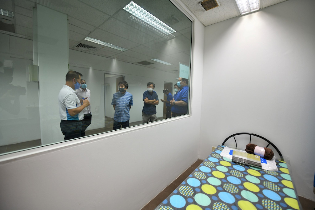 Singapore's Transport Minister Khaw Boon Wan is seen onboard a floating accommodation docked at Tanjong Pagar Terminal, meant to house healthy migrant workers, as the spread of the coronavirus disease (COVID-19) continues in Singapore, April 12, 2020. Courtesy of Singapore's Ministry of Transport/Handout via REUTERS