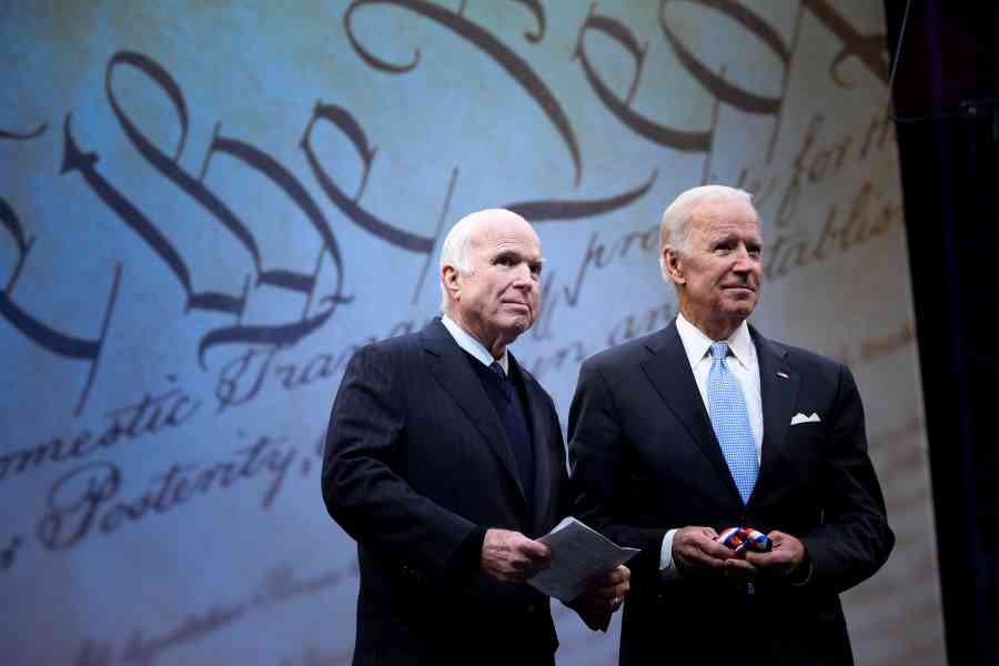 U.S. Senator John McCain (R-AZ) is awarded the 2017 Liberty Medal by former U.S. Vice President Joe Biden at the Independence Hall in Philadelphia, Pennsylvania, U.S., October 16, 2017. REUTERS/Charles Mostoller/File Photo