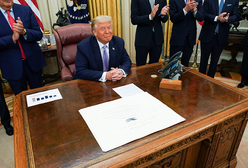 U.S. President Donald Trump receives applause after announcing that Israel and the United Arab Emirates have reached a peace deal that will lead to the full normalization of diplomatic relations between the two Middle Eastern nations in an agreement that Trump helped broker, at White House in Washington, U.S., August 13, 2020. REUTERS/Kevin Lamarque