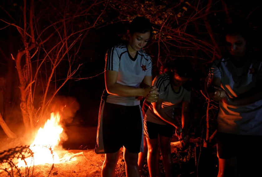 Rachana, a 25-year-old corporal, who gave only her first name applies sanitizer after handling bodies of coronavirus victims. REUTERSpic
