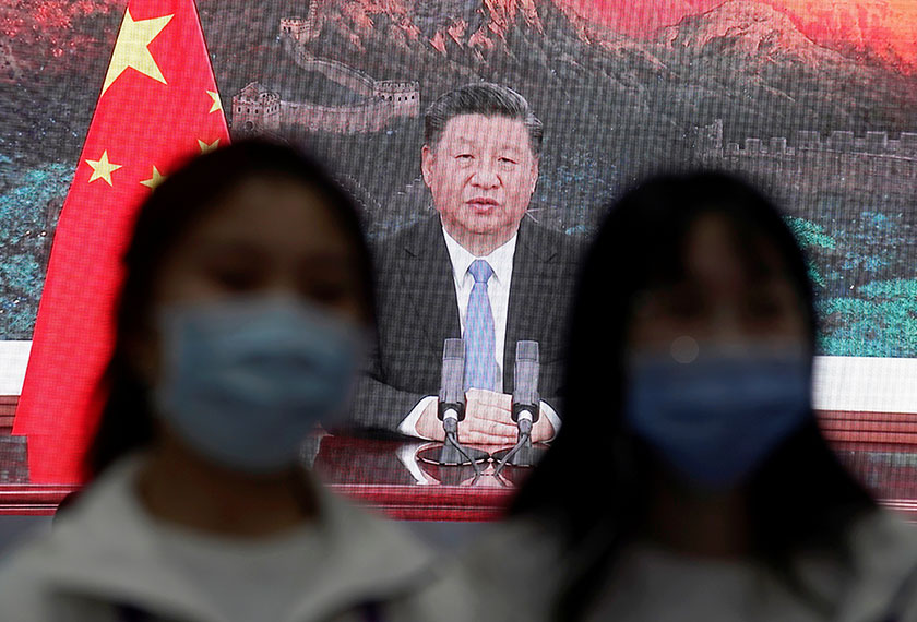 China's President Xi Jinping is seen on a screen in the media center as he speaks at the opening ceremony of the third China International Import Expo (CIIE) in Shanghai, China November 4, 2020. REUTERS/Aly Song
