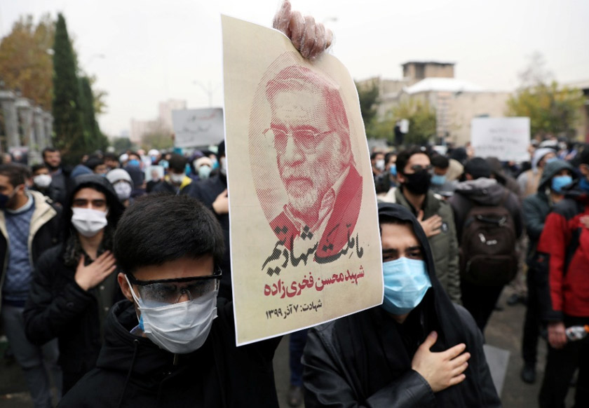 A protester holds a picture of Mohsen Fakhrizadeh, Iran's top nuclear scientist, during a demonstration against his killing in Tehran, Iran, November 28, 2020. Image by Majid Asgaripour/WANA (West Asia News Agency) via REUTERS
