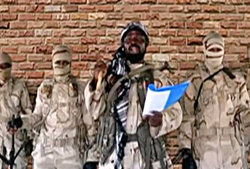 Leader of one of the Boko Haram group's factions, Abubakar Shekau speaks in front of guards in an unknown location in Nigeria in this still image taken from an undated video obtained on Jan 15, 2018. Image by Boko Haram Handout/Sahara Reporters via REUTERS