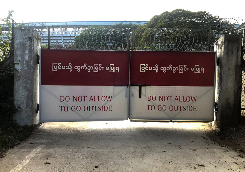 A closed gate with a message on it is pictured at the Ayeyarwady Center B facility where COVID-19 patients and asymptomatic cases are quarantined, amid the coronavirus disease (COVID-19) outbreak in Yangon, Myanmar, December 8, 2020. Picture taken December 8, 2020. REUTERS/Shoon Naing