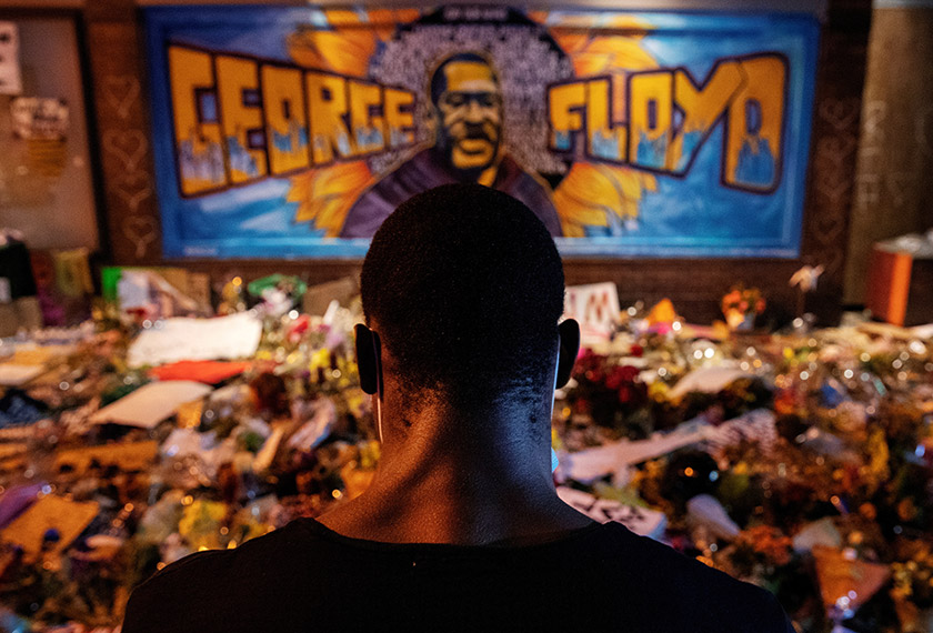 A man recites spoken word poetry at a makeshift memorial honoring George Floyd, at the spot where he was taken into custody, in Minneapolis, Minnesota, U.S., June 1, 2020. - REUTERS