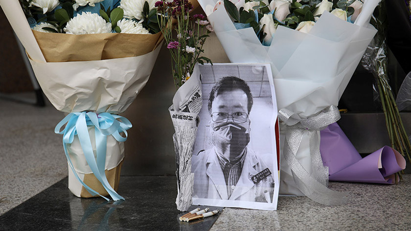 A makeshift memorial for Li Wenliang, a doctor who issued an early warning about the coronavirus outbreak before it was officially recognized, is seen after Li died of the virus, at an entrance to the Central Hospital of Wuhan in Hubei province, China February 7, 2020. REUTERS/Stringer