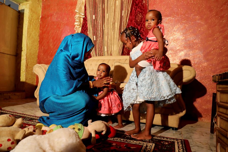 Youssria Awad plays with her daughters in their home, in Khartoum, Sudan on June 14, 2020. She refuses to carry out female genital mutilation on them, a practice that involves partial or total removal of the external female genitalia for non-medical reasons that The World Health Organization says FGM constitutes an 