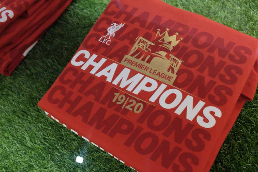 Kemeja T Champions pada harga RM59, lebih murah daripada yang dijual di laman web rasmi Liverpool FC.