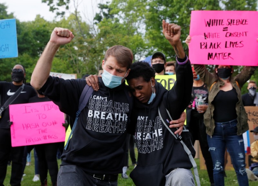 Jacque Jackson (R) and Charlie St. Pierre take part in a rally following the death in Minneapolis police custody of George Floyd, in Boston, Massachusetts, U.S., June 2, 2020. REUTERS/Brian Snyder