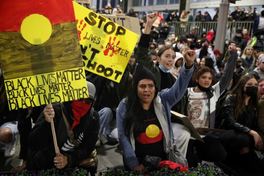 People protest in solidarity with those in the United States protesting police brutality and the death in Minneapolis police custody of George Floyd, in Sydney, Australia, June 2, 2020 - REUTERS/Loren Elliott