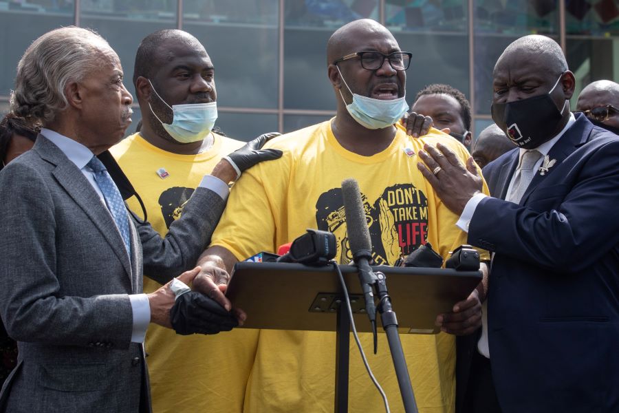 Philonise Floyd, brother of George Floyd, whose death in Minneapolis police custody has sparked nationwide protests against racial inequality, is held by Reverend Al Sharpton and attorney Ben Crump as he gets emotional during a speech during the public viewing of Floyd at The Fountain of Praise church in Houston, Texas, U.S., June 8, 2020. Standing in the background is George Floyd’s younger brother Rodney Floyd. REUTERS/Adrees Latif