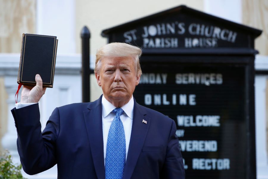 In this Monday, June 1, 2020 file photo, President Donald Trump holds a Bible as he visits outside St. John's Church across Lafayette Park from the White House - AP Photo/Patrick Semansky, File 