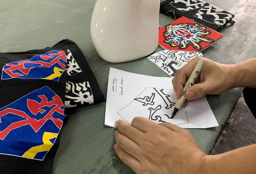 Pelitup muka dengan motif batik ini menjadi trend yang digemari di Malaysia. - Reuters