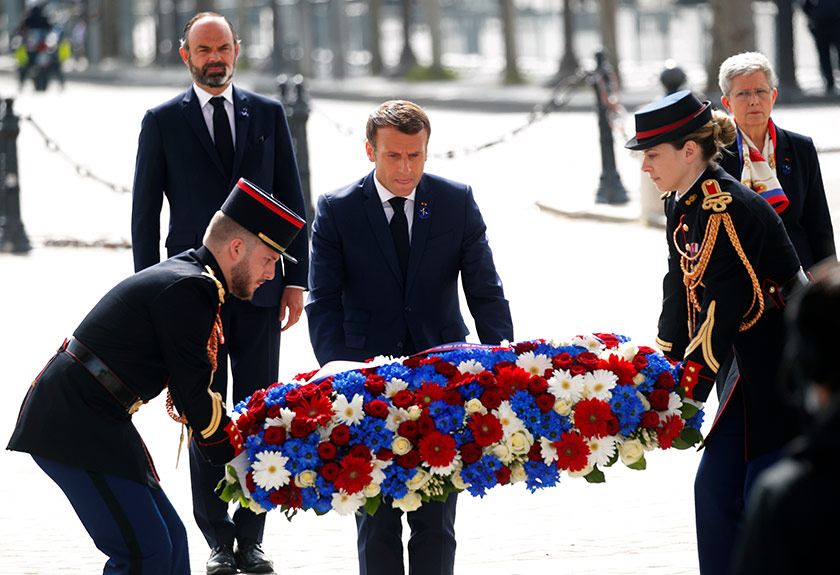 French President Emmanuel Macron lays a wreath of flowers during a ceremony to mark the 75th anniversary of the World War II victory over Nazi Germany, at the Arc de Triomphe in Paris, May 8, 2020. (AP Photo)