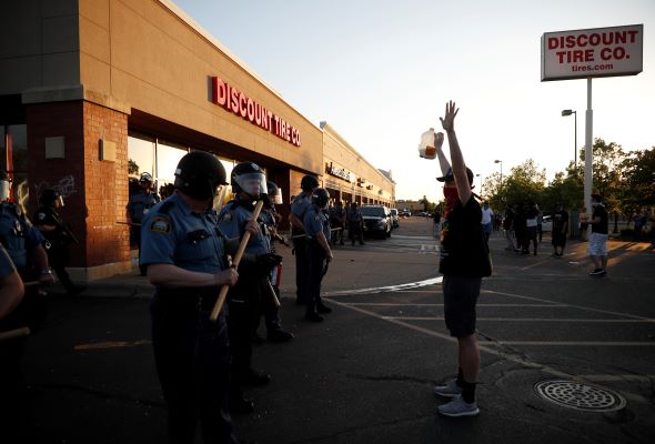 Demonstrators gather Thursday, May 28, 2020, in St. Paul, Minn. Protests over the death of George Floyd, the black man who died in police custody, broke out in Minneapolis for a third straight night - AP Photo/John Minchillo