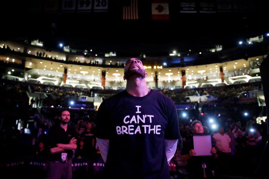 In this Dec. 9, 2014, file photo, Los Angeles Lakers' Carlos Boozer, wearing a T-shirt reading 