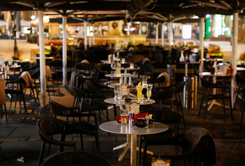 Half empty glasses and cups are seen in a cafe after exchanges of gunfire in Vienna, Austria November 3, 2020. REUTERS/Leonhard Foeger