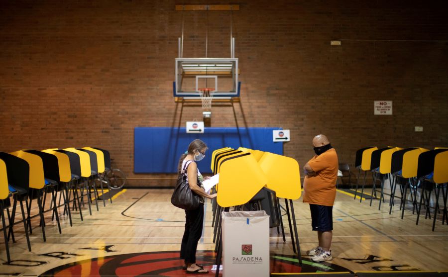 People vote during the U.S. presidential election in the gymnasium of the Victory Park Recreation Center during the outbreak of the coronavirus disease (COVID-19), in Pasadena, California, U.S., November 2, 2020. REUTERS