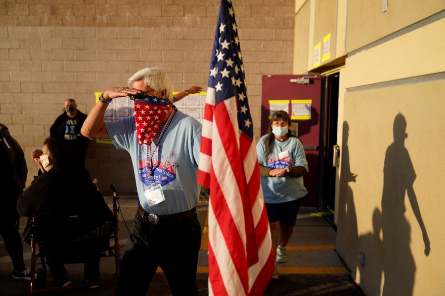 Poll workers prepare to open a polling place on Election Day, Tuesday, Nov. 3, 2020, in Las Vegas.