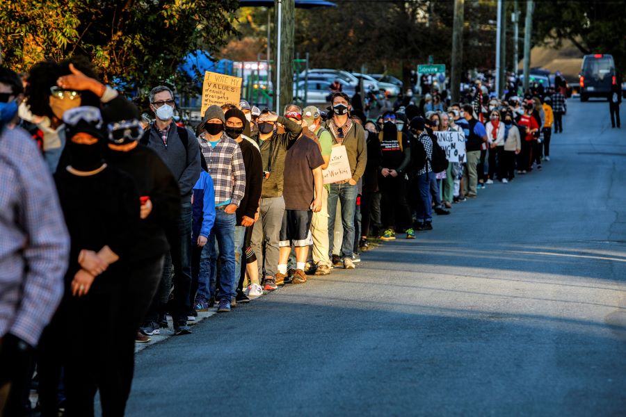 Demonstrators are seen in a line at a march for voting rights on Election Day in Graham, North Carolina, U.S., November 3, 2020. REUTERS/Jonathan Drake