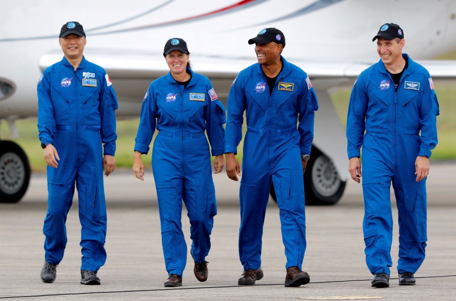 NASA astronauts Shannon Walker, Victor Glover, Mike Hopkins, and JAXA (Japan Aerospace Exploration Agency) astronaut Soichi Noguchi, who comprise Crew-1, walk at Kennedy Space Center ahead of the NASA/SpaceX launch of the first operational commercial crew mission in Cape Canaveral, Florida, U.S., November 8, 2020. REUTERS/Joe Skipper/File Photo
