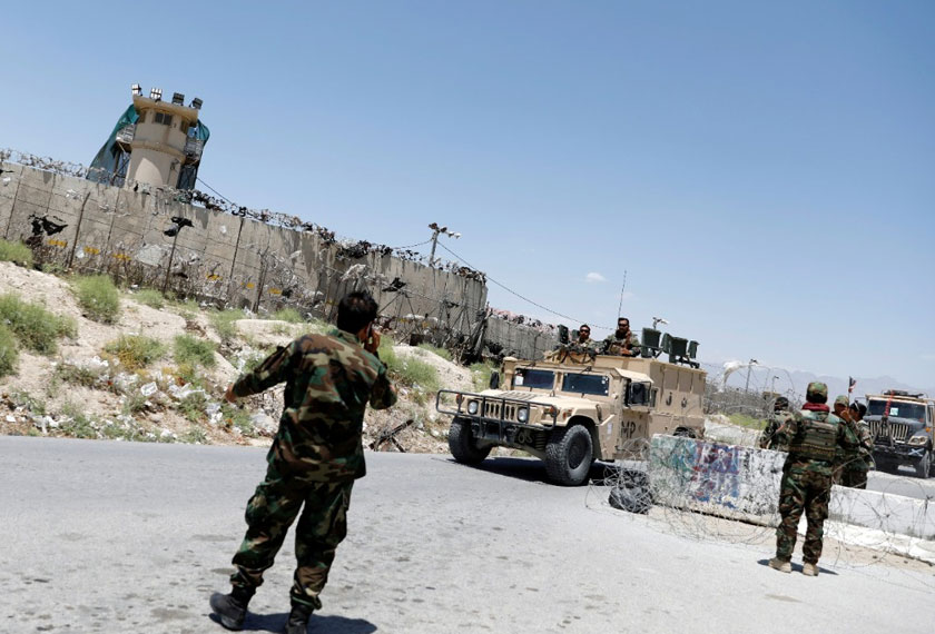 Afghan soldiers stand guard at a checkpoint outside the US Bagram air base, July 2, 2021. -REUTERS