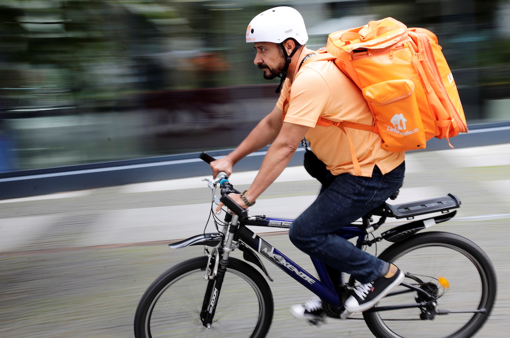 ormer Afghan Communication Minister Sayed Sadaat rides a bicycle for his food delivery service job with Lieferando in Leipzig, Germany, August 26, 2021. REUTERS/Hannibal Hanschke