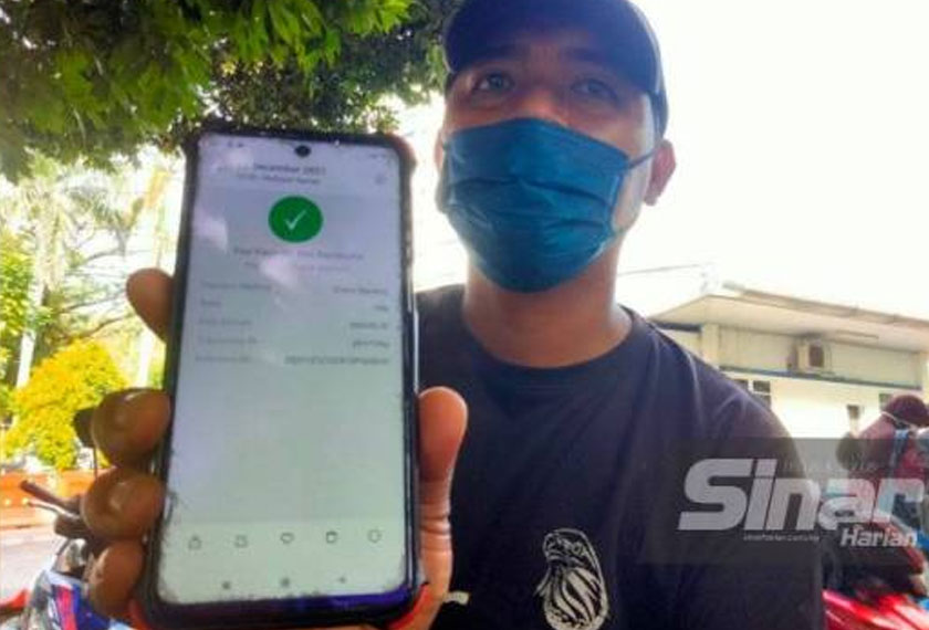 Hanafi berjaya menjelaskan saman secara dalam talian selepas menunggu lama. - Foto Sinar Harian