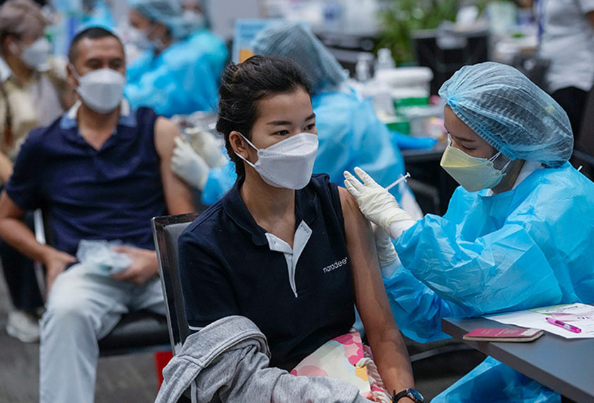 A health worker administers a dose of COVID-19 vaccine to a person in Bangkok. - REUTERS