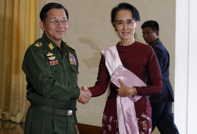 Senior General Min Aung Hlaing, Myanmar's commander-in-chief, shakes hands with National League for Democracy (NLD) party leader Aung San Suu Kyi before their meeting in Hlaing's office at Naypyitaw Dec 2, 2015. REUTERS file pic