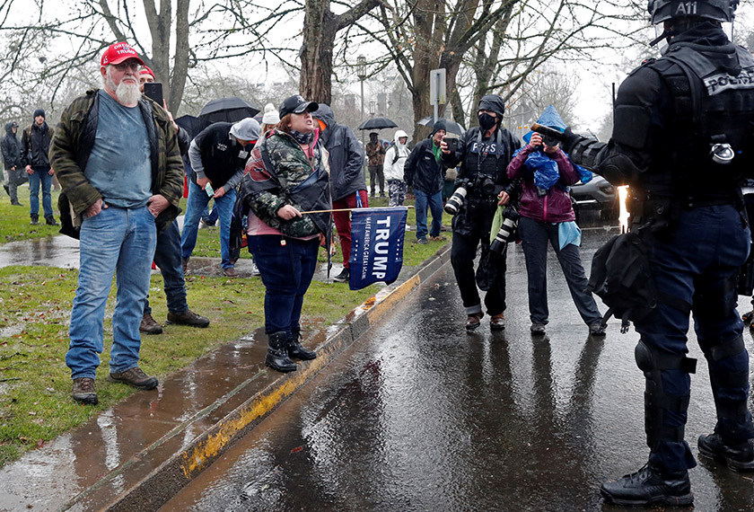 Supporters of U.S. President Donald Trump confront police at a rally in support of Trump at the Oregon State Capitol in Salem, Oregon, U.S. January 6, 2021. REUTERS/Terray Sylvester
