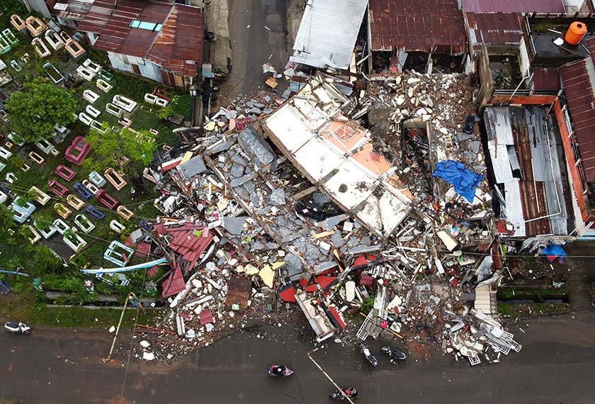A building is seen badly damaged following an earthquake in this aerial photo taken using a drone in Mamuju, West Sulawesi, Indonesia, Saturday, Jan. 16, 2021. (AP Photo/Abdi Latief)