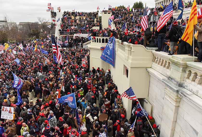 Supporters of U.S. President Donald Trump climb on walls at the U.S. Capitol during a protest against the certification of the 2020 U.S. presidential election results by the U.S. Congress, in Washington, U.S., January 6, 2021. REUTERS/Jim Urquhart