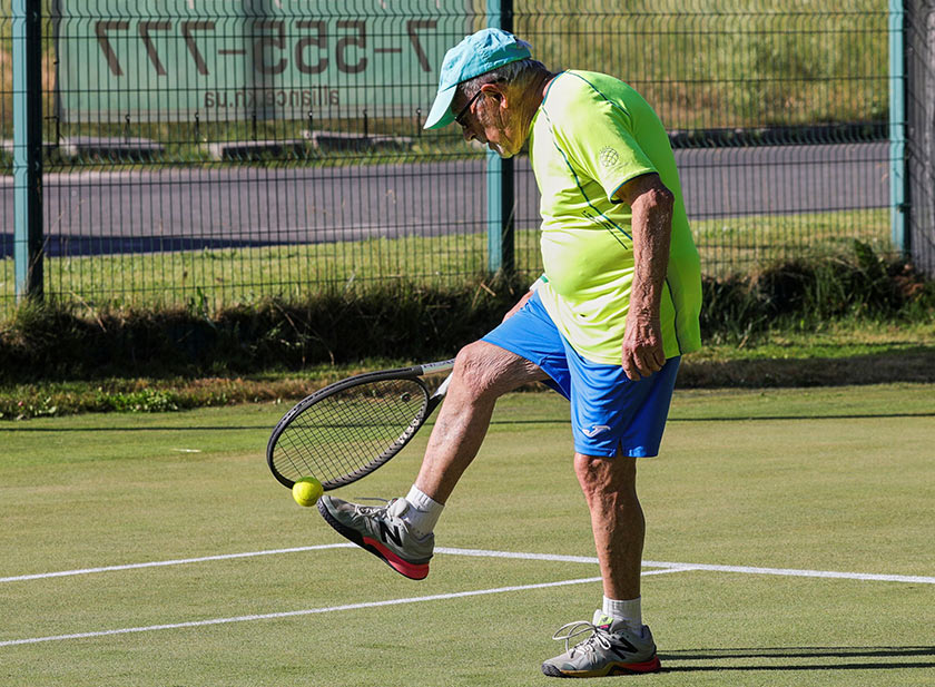 The world's oldest tennis player Ukrainian Leonid Stanislavskyi, 97, practices on court in Kharkiv, Ukraine July 13, 2021. Picture taken July 13, 2021. REUTERS/Sergiy Kozlov