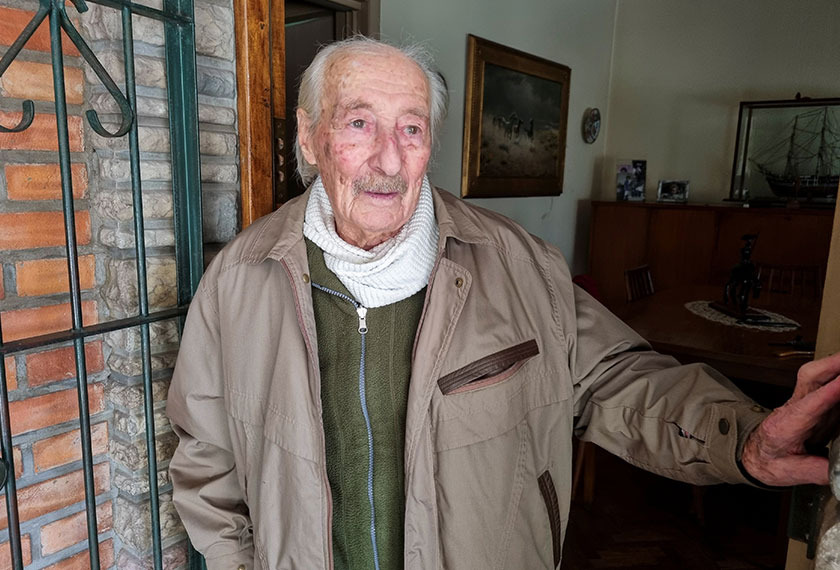 Hernan Mastrangelo, a 100-year-old former chocolatier and a fan of Argentine soccer star Lionel Messi, poses for a photograph, in Buenos Aires, Argentina July 20, 2021. Picture taken July 20, 2021. REUTERS/Miguel Lo Bianco