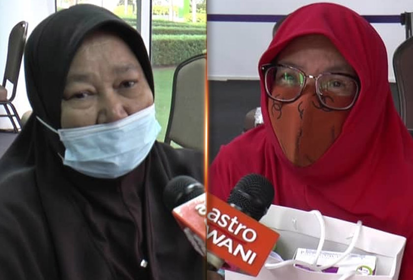  Hameh (kiri) dan Majemin antara warga emas yang tidak melepaskan peluang menerima vaksin di Pulau Pinang hari ini. - Astro AWANI