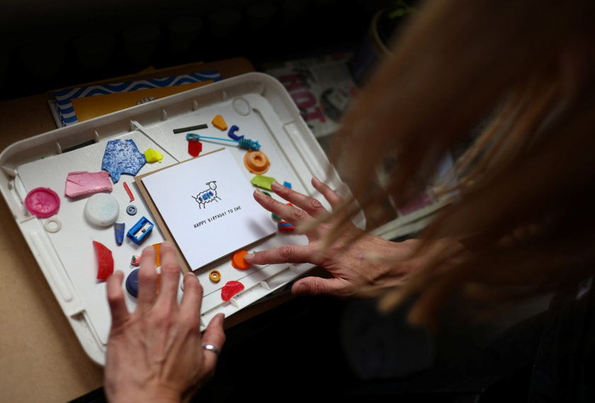 Blathwayt creates card designs in her flat in Peckham, using plastics found washed up on the banks of the river Thames, in Deptford, London, Britain. REUTERSpic