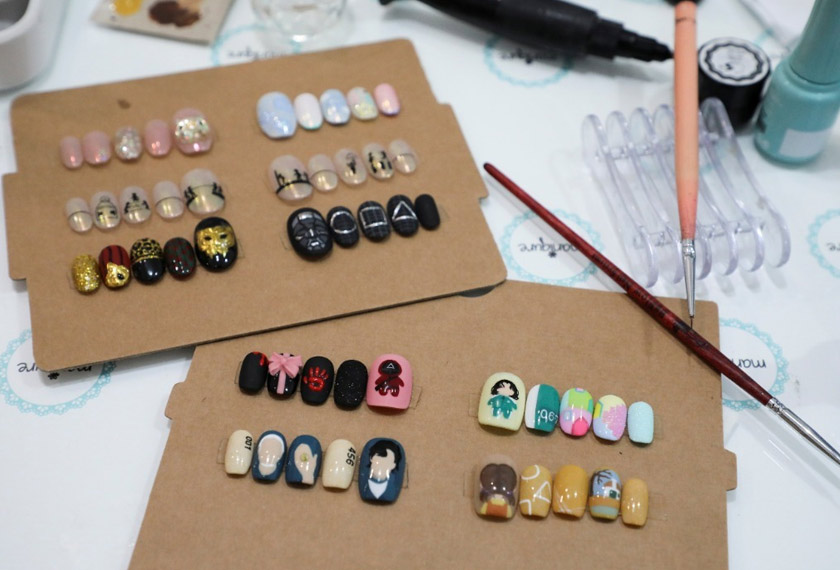 Samples of Squid Game's manicure are displayed at the nail salon Maniqure in Kuala Lumpur, Malaysia. - REUTERS