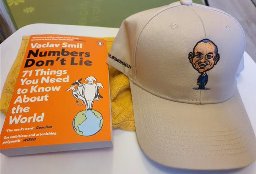 Book and Cap from #TeamOKMInterns2021