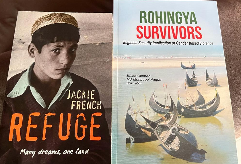 Dua buku yang menggambarkan kisah suka duka menjadi pelarian, berlindung di negara jiran yang menerima mereka sementara membina kehidupan baharu. - Gambar Astro AWANI