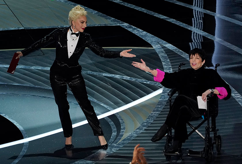 Lady Gaga supports Liza Minnelli as they present Best Picture Oscar. - REUTERS