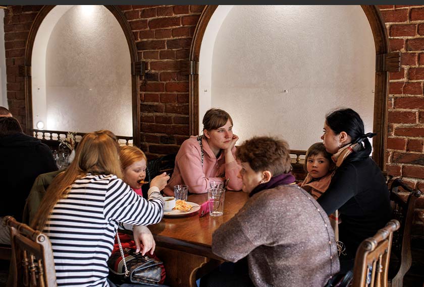 Refugees are served a free meal at Ukrainian celebrity chef Ievgen Klopotenko's restaurant, in Lviv, Ukraine. - REUTERS