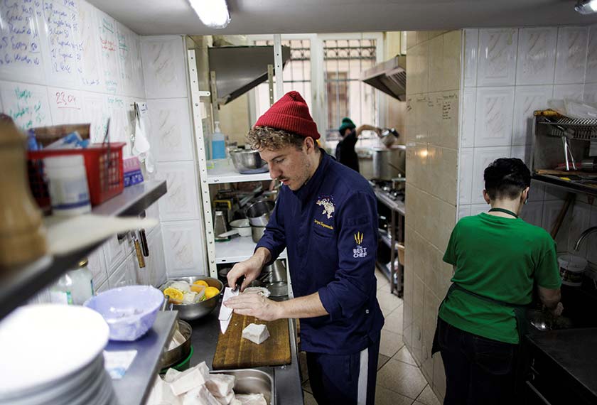 Ukrainian celebrity chef Ievgen Klopotenko cooks in his restaurant’s kitchen, in Lviv, Ukraine. - REUTERS